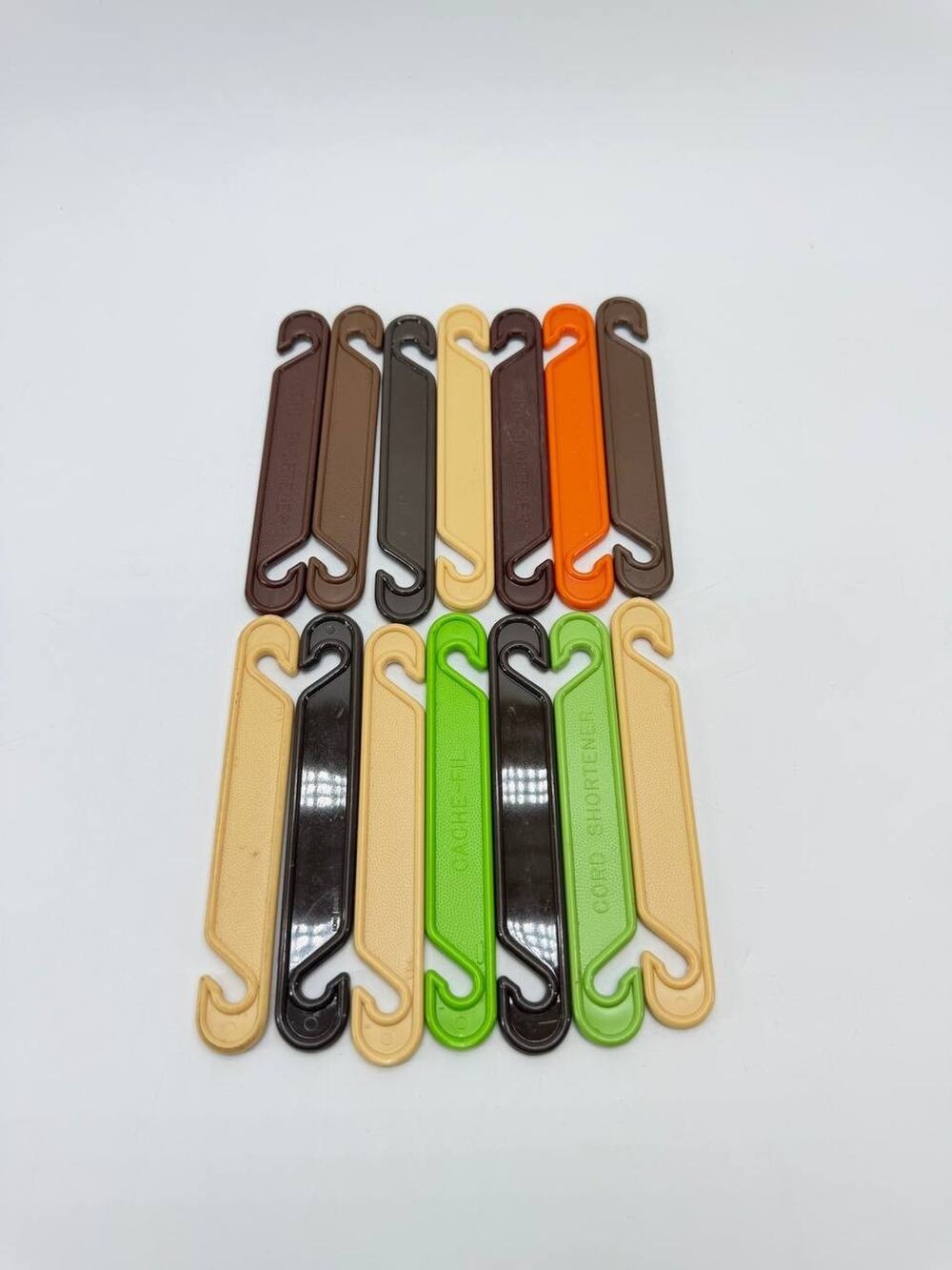 Vintage Tupperware Cache-Fil Cord Shortener Cable Organizer Lot of 14